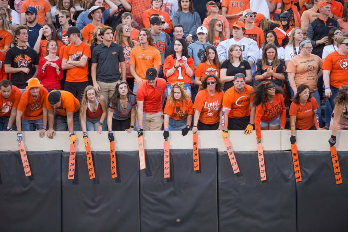 Sep 22, 2018; Stillwater, OK, USA; Oklahoma State Cowboys paddle people hit the sides of the stands during the game against the Texas Tech Red Raiders at Boone Pickens Stadium. Texas Tech won the game 41-17.
